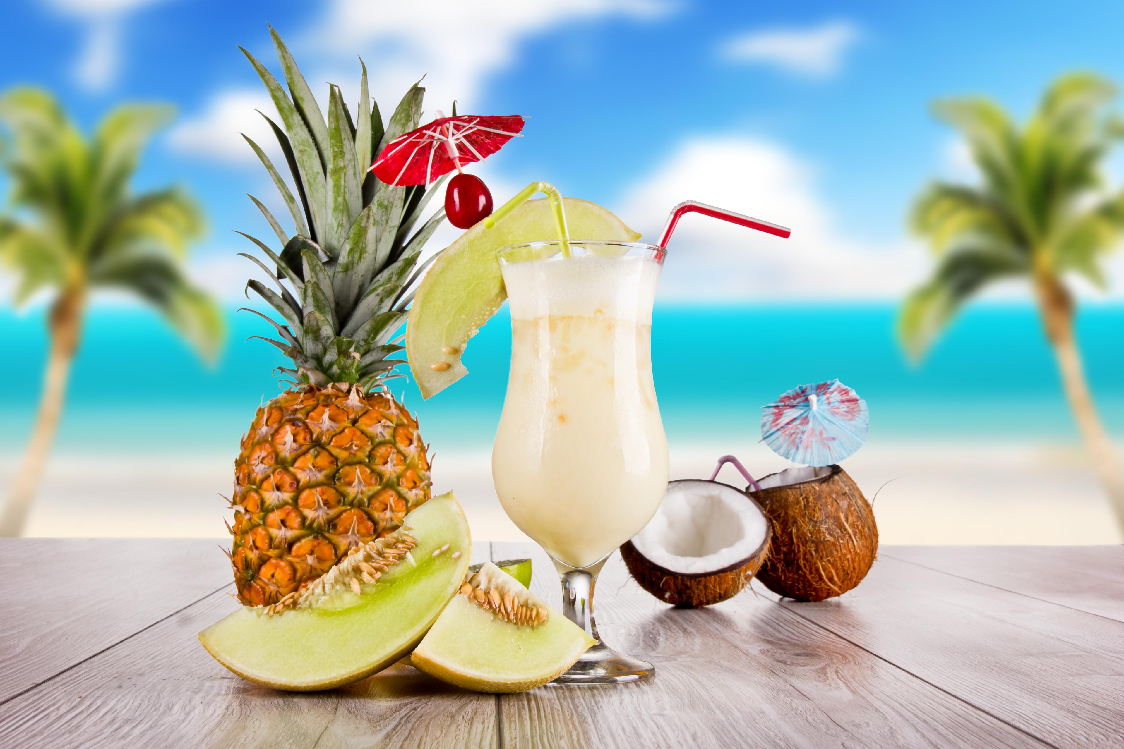summer-food-cocktail-cocktail-glass-coconut-pineapple-table-sky-clouds-palm-trees-sea